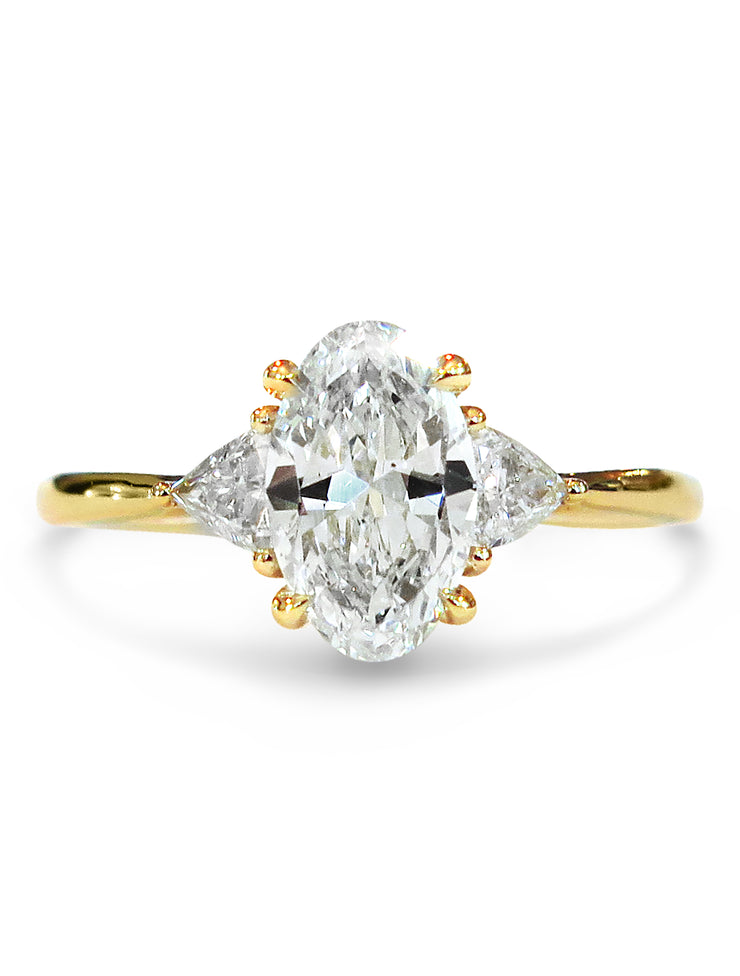 Lucine oval diamond 3 stone engagement ring in yellow gold with trillion side stones