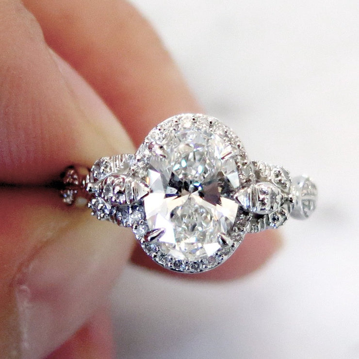 Unique oval diamond halo with nature inspired details in platinum - Maiya