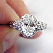 Unique oval diamond halo with nature inspired details in platinum - Maiya