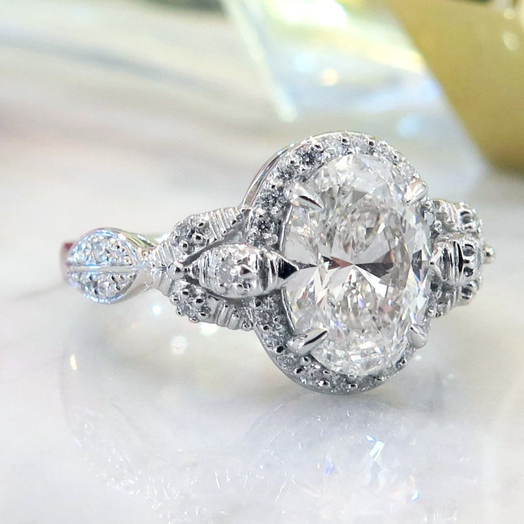 Oval diamond halo in platinum with organic details - Maiya