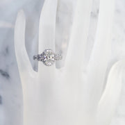 Unique oval diamond halo on hand in platinum with conflict free diamonds - Maiya