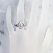 Unique oval diamond halo on hand in platinum with conflict free diamonds - Maiya