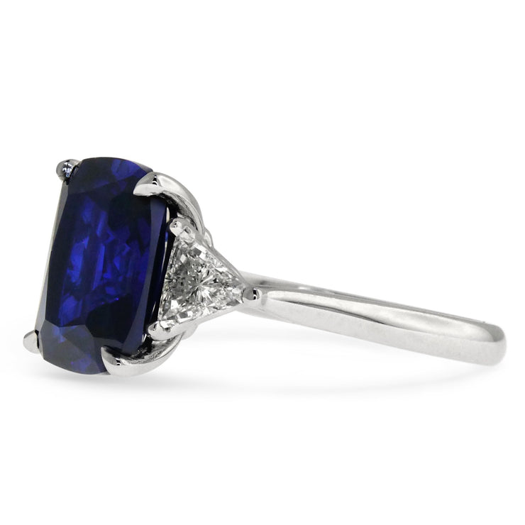 SIDE VIEW 4 carat sapphire engagement ring with trillion diamond accents. DANA WALDEN BRIDAL.
