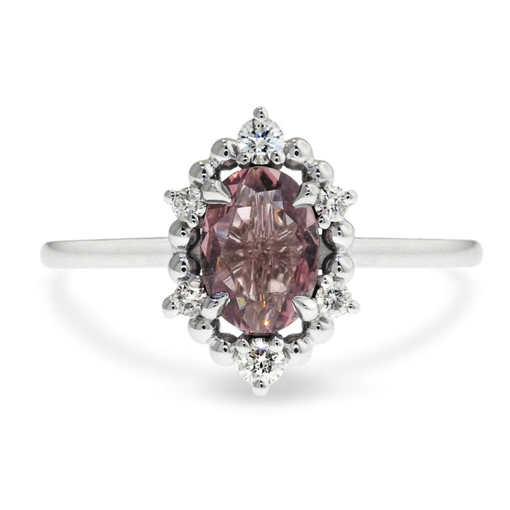 Mauve sapphire engagement ring in unique diamond halo designed by Dana Walden Bridal