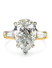 2 carat pear shaped engagement ring in yellow gold with baguette accent stones. DANA WLADEN BRIDAL.