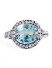 Unique art deco engagement ring with aquamarine and diamonds. Made in New York City.