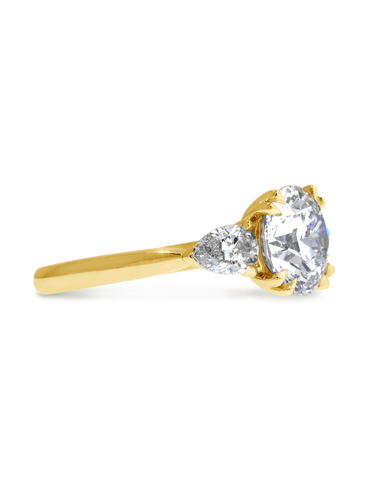 Yellow gold three-stone diamond engagement ring, made in New York City.