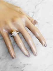 Classic diamond halo on hand in platinum or white gold with delicate silhouette - Primrose