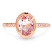 Peachy pink sapphire engagement ring with diamonds in rose gold, designed by dana walden bridal in nyc