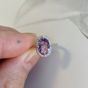 Purple Sapphire Halo Engagement Ring in White Gold - NYC - shown being held with jewelers fingers