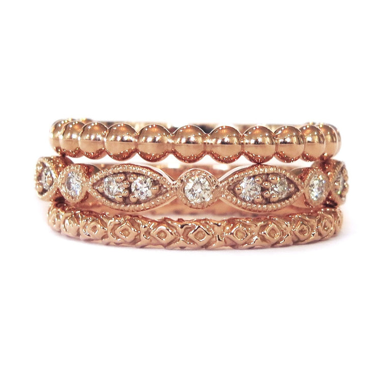 A suite of 3 handmade stackable rose gold rings . DANA WALDEN BRIDAL.