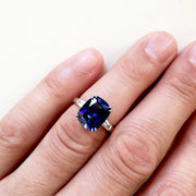 ON HAND: 4 carat lab sapphire with baguette diamond accents. DANA WALDEN BRIDAL.