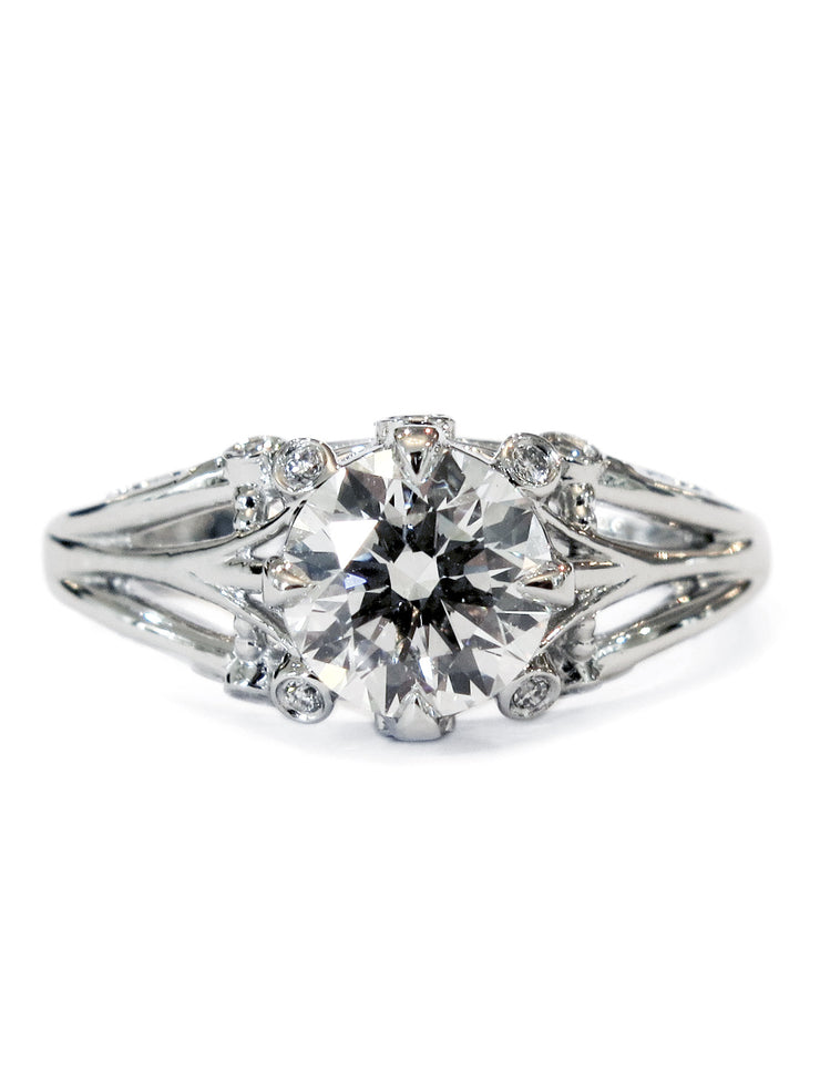 Yasmine floral engagement ring made of white gold and diamonds.