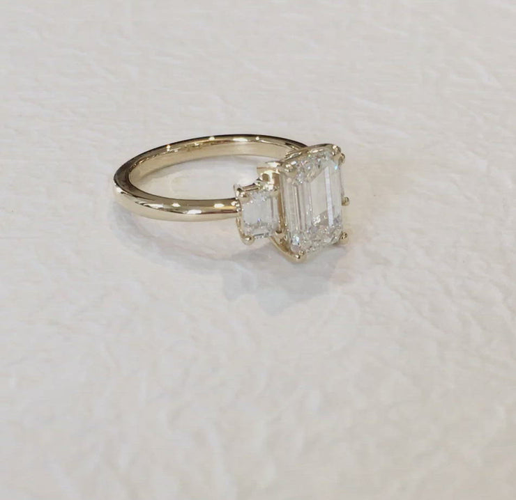 Video Emma Emerald Cut Diamond Three Stone Engagement Ring in White Gold by Dana Walden Bridal NYC