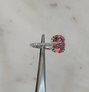 video of Padparadscha pink lab sapphire engagement ring with white diamond accents. DANA WALDEN BRIDAL NYC.