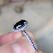 Ethical, handmade engagement ring with teal and blue sapphires set in white gold. Dana Walden Jewelry NYC.