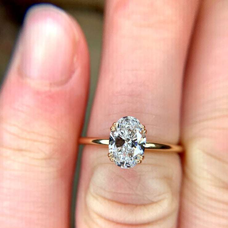 Oval cut lab diamond engagement ring in 14k yellow gold. Dana Walden Bridal NYC.