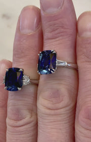 Video of two lab sapphire engagement rings on a hand. DANA WALDEN NYC.