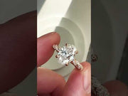 Video of 1.57 carat  lab grown oval diamond engagement ring with twisted diamond paved band in 18k rose gold in hand