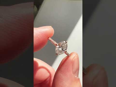 Video of Milly 1.01 carat lab grown diamond engagement ring with thin diamond micro-pavé band and low set diamond in sustainable 14k rose gold with compass NSEW claw prongs