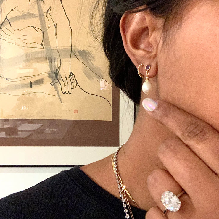 Rad wearing Iyla pearl drop earrings with a Jessa Oval Diamond engagement ring . Dana Walden Jewelry NYC.