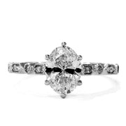Tulia oval diamond solitaire with ornate band and diamond accents. Dana Walden Bridal NYC.