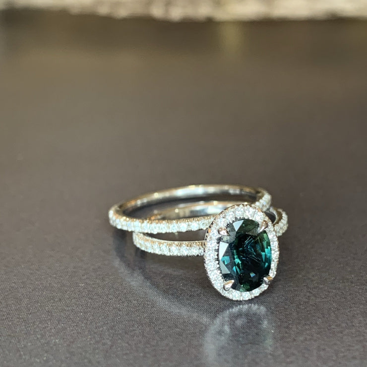 Teal sapphire with diamond halo and diamond micro pave set in white gold. DANA WALDEN BRIDAL. 