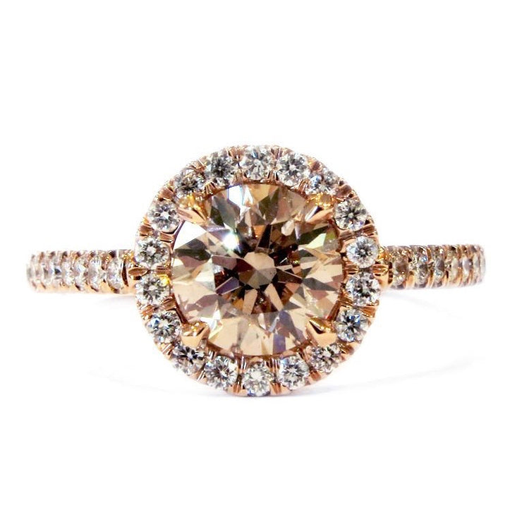 Unique bronze diamond engagement ring with a white diamond halo and micro pave band by Dana Walden in New York City.