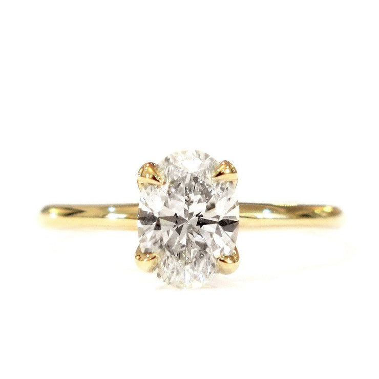 Lab-created diamond oval solitaire engagement ring by Dana Walden Bridal.