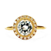 Unique diamond halo engagement ring set in yellow gold. Handmade in New York City by Dana Walden Jewelry.