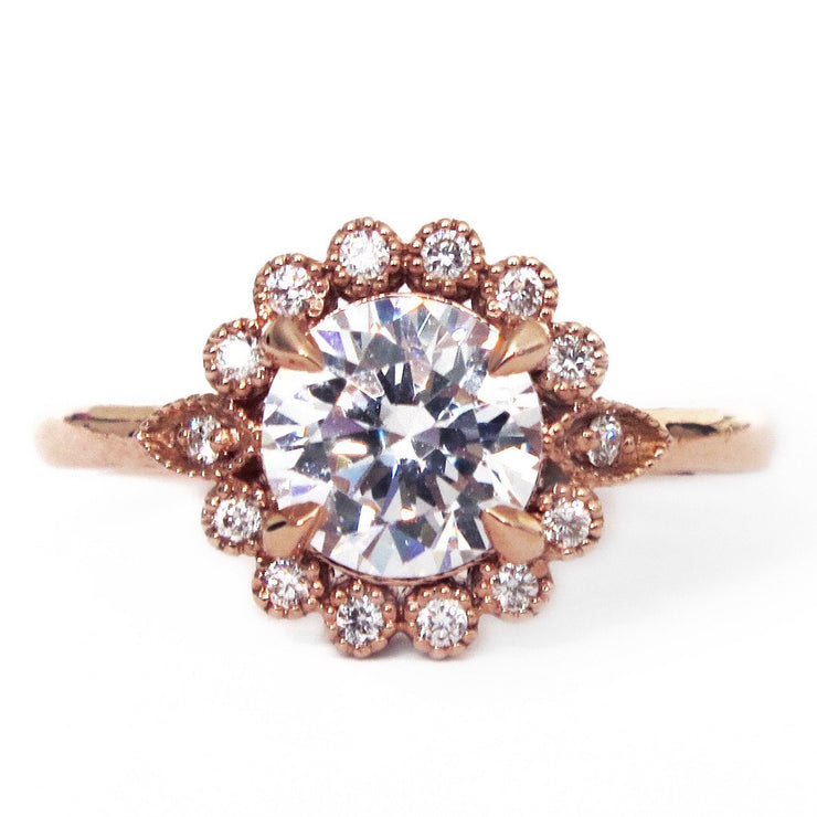 Handmade unique diamond halo engagement ring that resembles a floral bloom. Rose gold setting handmade by Dana Walden Bridal NYC.