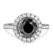 Unique black diamond engagement ring with a conflict-free white diamond halo. DANA WALDEN BRIDAL NYC.
