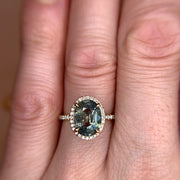 3.68 carat Green Blue Sapphire & Diamond Halo Engagement Ring in Yellow Gold on the Hand by Dana Walden Bridal NYC