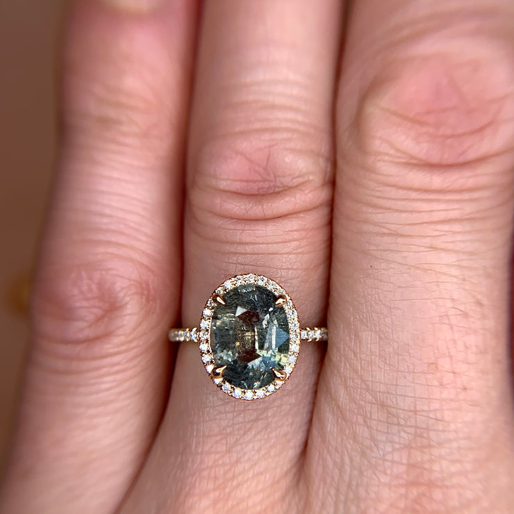 3.68 carat Green Blue Sapphire & Diamond Halo Engagement Ring in Yellow Gold on the Hand by Dana Walden Bridal NYC