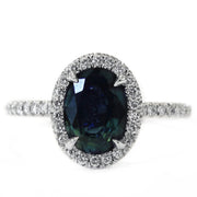 Teal sapphire with diamond halo and diamond micro pave set in white gold. DANA WALDEN BRIDAL. 