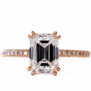 Conflict-free ethical emerald cut diamond set in rose gold with micropave band. Dana Walden Bridal.