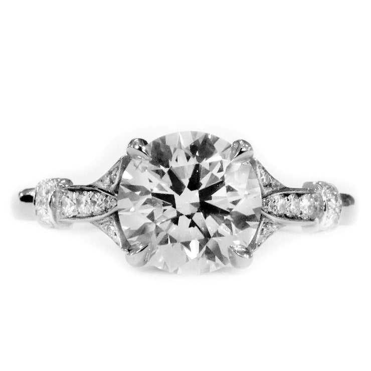 Art deco diamond solitaire engagement ring with leafy details. Made in New York City by Dana Walden Bridal.