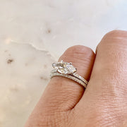 Dana Walden conflict-free diamond marquise engagement ring with a micro pave wedding band. Made in NYC.
