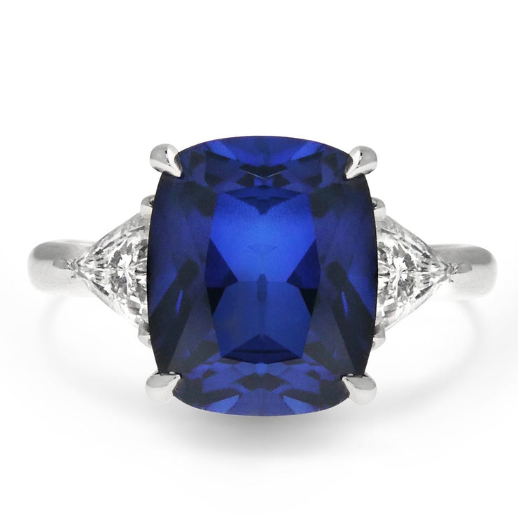 4 carat sapphire engagement ring with trillion diamond accents. DANA WALDEN BRIDAL.