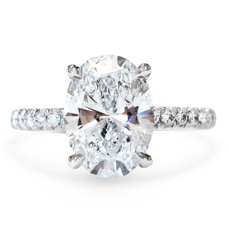 Oval lab diamond solitaire with pave lab-grown diamonds in the band.