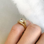 Dana Chin showing off the Nicoletta splits shank engagement ring with a bezel set diamond.
