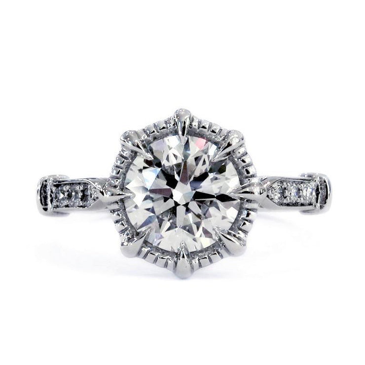 Platinum diamond solitaire engagement ring with vintage-style flourishes. Dana Walden Bridal NYC.