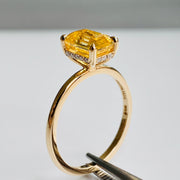 Alternative Yellow sapphire engagement ring in emerald cut on delicate gold band