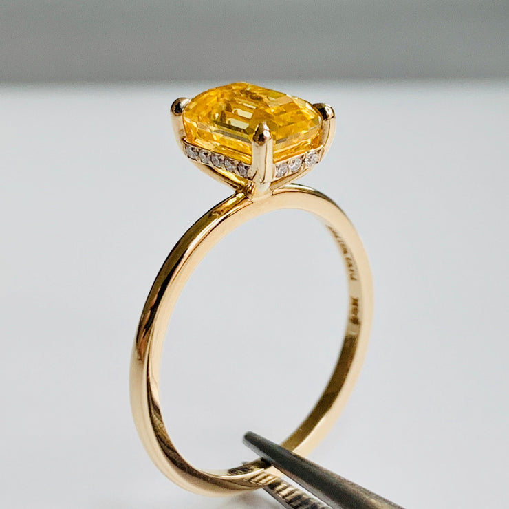 Alternative Yellow sapphire engagement ring in emerald cut on delicate gold band