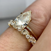 Margot pear-shaped solitaire with diamond band by Dana Walden Bridal.