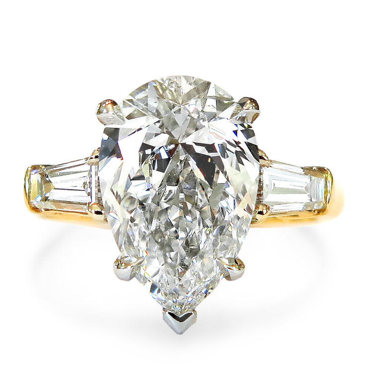 2 carat pear shaped engagement ring in yellow gold with baguette accent stones. DANA WLADEN BRIDAL.