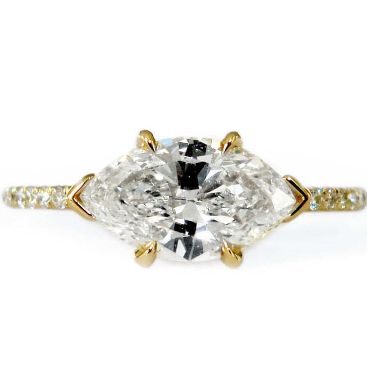 East-West ethical diamond marquise engagement ring set in yellow gold.