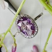 Unique engagement rings- Oval lavender sapphire engagement ring with conflict free diamond halo. DANA WALDEN NYC.