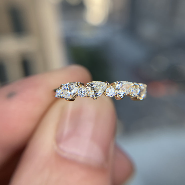 Diamond wedding band with alternating pear-shaped white diamonds and round diamonds. DANA WALDEN BRIDAL NYC.