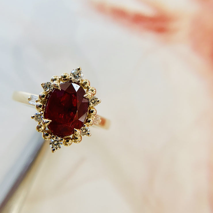 Handmade ruby ring with gold bead and diamond halo. DANA WALDEN BRIDAL, NYC.
